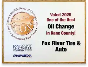 A plaque showing Best of the Fox 2025 award, naming Fox River Tire & Auto as one of the best for oil change in Kane County. Also includes Kane County Chronicle and Shaw Media logos.