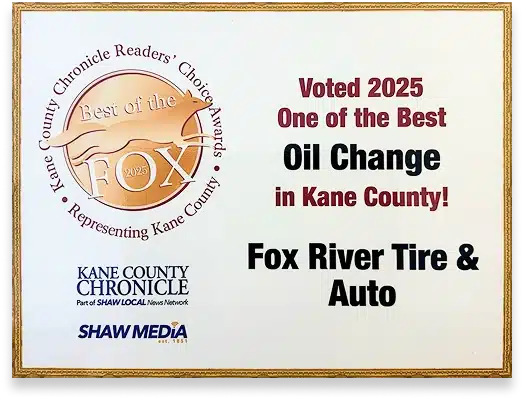 A plaque showing Best of the Fox 2025 award, naming Fox River Tire & Auto as one of the best for oil change in Kane County. Also includes Kane County Chronicle and Shaw Media logos.