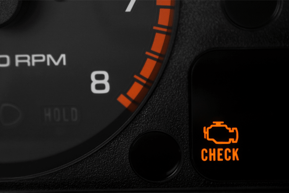 Check Engine Light Diagnostic in St. Charles at Fox River Tire & Auto. Illuminated check engine light on a car dashboard.