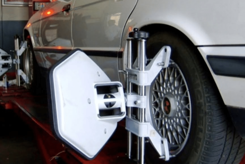 Wheel Alignment in St. Charles IL At Fox River Tire & Auto. Image of Hunter alignment target mounted on a car tire during a wheel alignment inspection